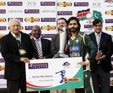 PCB Chairman Shaharyar M Khan gives away winning cheque and trophy to Pakistan A captain Fawad A.jpg