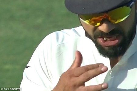 3AA5C0D900000578-3959860-Footage_has_emerged_of_Virat_Kohli_appearing_to_use_a_sweet_to_s-a-52_1.jpg