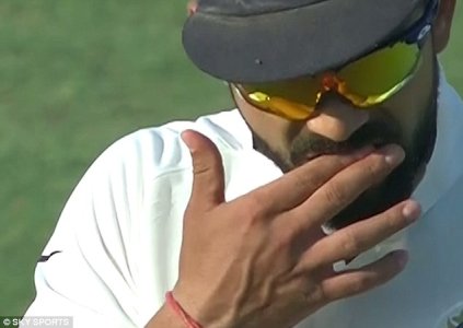 3AA5C29500000578-3959860-Kohli_can_be_seen_rubbing_the_inside_of_his_mouth_shortly_before-a-54_1.jpg