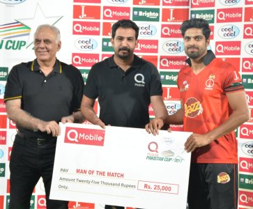 Director Cricket Oprations Mr. Haroon Rasheed giving away man of the match award to Umar Amin of.JPG