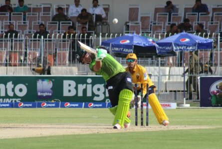 Kamran hits a sizzling on drive for four runs.jpg