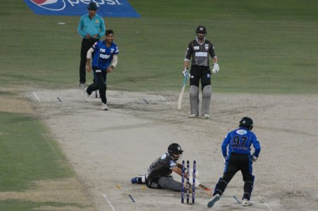Adnan Akmal quickly stump to Khushdil Shah on the bowling of M. Asghar.JPG