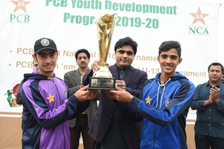 Captains of CP U16 & KP U16 receiving trophy from chief guest Muhammad Ali, Deputy Commissioner .jpg