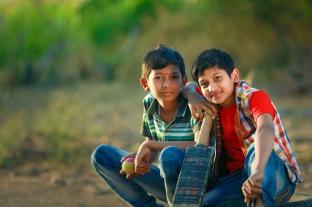 rural-indian-child-playing-cricket_75648-740.jpg