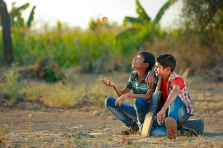 rural-indian-child-playing-cricket_75648-743.jpg