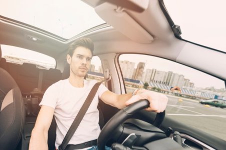 portrait-handsome-young-man-driving-car_23-2147937236.jpg