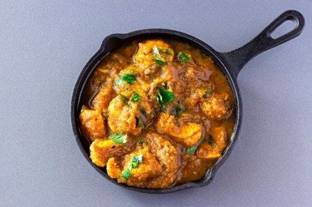 traditional-indian-butter-chicken-curry-lemon-served-iron-cast-top-view-traditional-world-cuisin.jpg