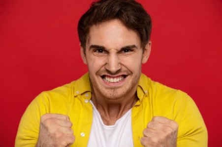 yeah-we-did-it-excited-man-yellow-shirt-showing-yes-gesture-keeps-fists-clenched-victory-gesture.jpg