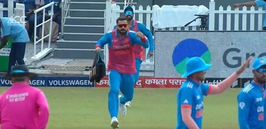Virat Kohli carrying Drinks.jpg