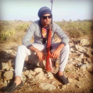 Jaddu with gun.jpg