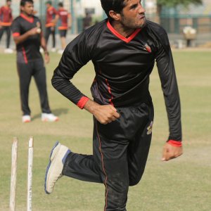 Mohammad Asghar practicing his bowling in training