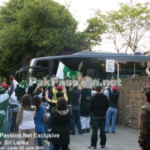 Pakistani supporters eagerly await the departing team bus
