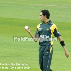 Umar Gul examines the ball very closely