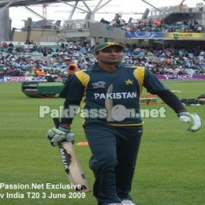 Shahzaib Hasan walks off the field after batting practice