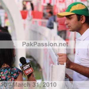 Faisal Iqbal speaks with a reporter