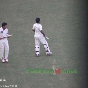 Adnan Akmal and Asad Shafiq, on their way to bat