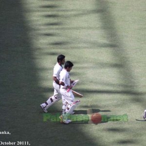 Adnan Akmal and Asad Shafiq, heading towards the pitch