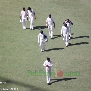 The Sri Lankan team head to the pavillion