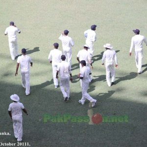 The Sri Lankan team players march towards their fielding positions