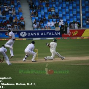 Younis Khan's sweep shot nearly takes out Alastair Cook on short leg