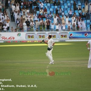 Anderson and Cook watch as the crowd gives a standing ovation to Younis Kha