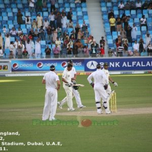 The crowd continues to applaud as Younis Khan walks back to the batting cre