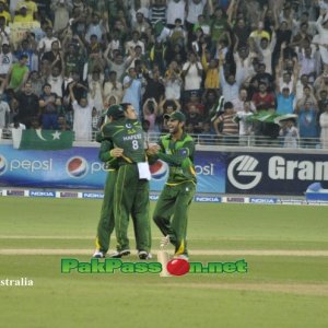 Ajmal and Hafeez celebrating after getting a wicket