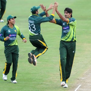 Mohammad Irfan, Junaid Khan and Nasir Jamshed celebrate a wicket