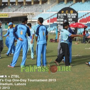 Players from Port Qasim and ZTBL shake hands