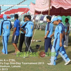 Players from Port Qasim and ZTBL shake hands