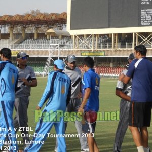 Players from Port Qasim and ZTBL shake hands