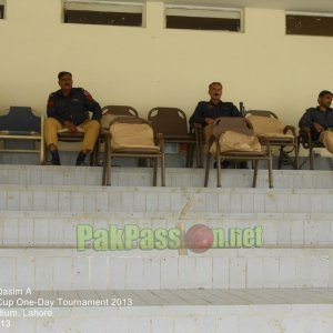 Police men watch the match