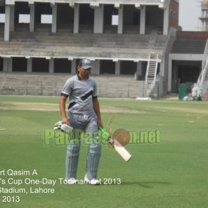 Kamran Younis walks back after being dismissed for a golden duck