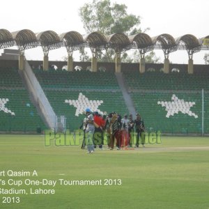 Players shake hands as KRL win the match by 40 runs