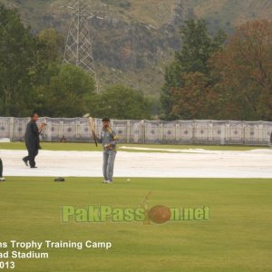 Coach Shahid Aslam conducts fielding drills with players