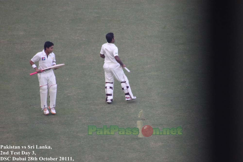 Adnan Akmal and Asad Shafiq, on their way to bat