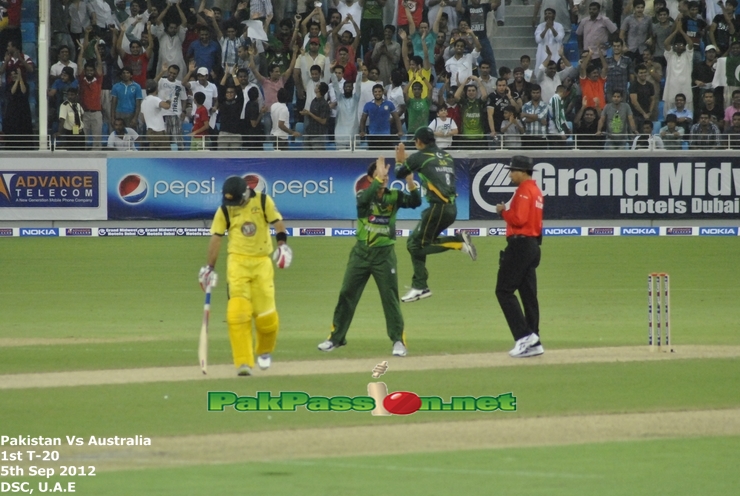 Ajmal and Hafeez celebrating after getting a wicket