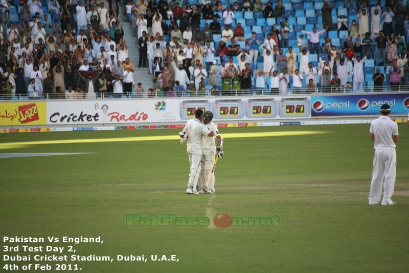 Azhar Ali congratulates Younis Khan on his hundred