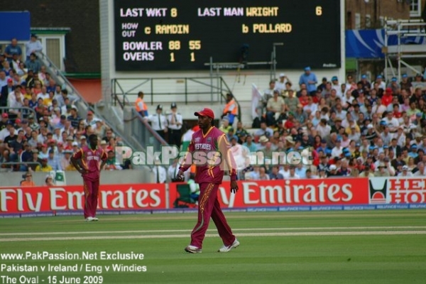 Chris Gayle walks back to his fielding position