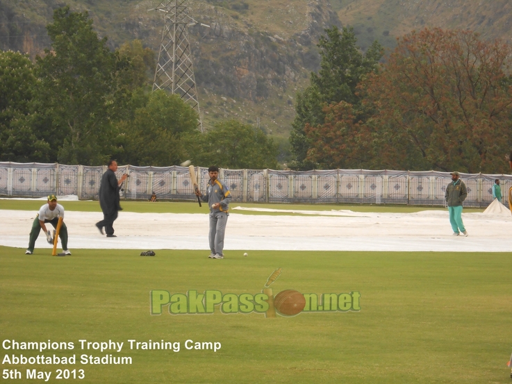 Coach Shahid Aslam conducts fielding drills with players