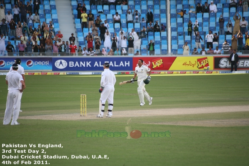 Fielders look towards the ball as Younis Khan completes a single