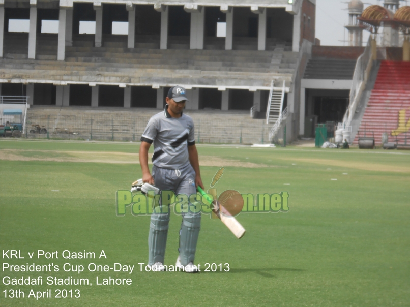 Kamran Younis walks back after being dismissed for a golden duck