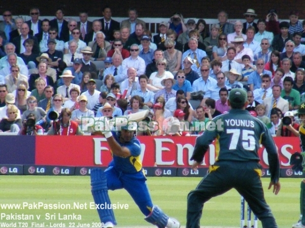 Kumar Sangakkara drives as Younis Khan looks on