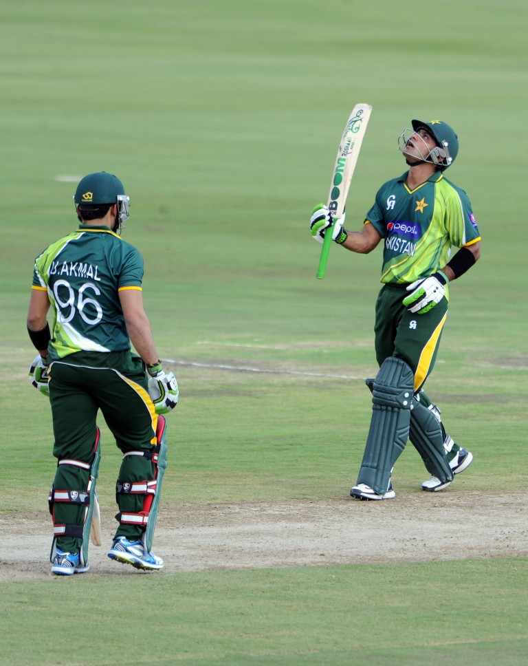 Mohammad Hafeez celebrates as he reaches his half century