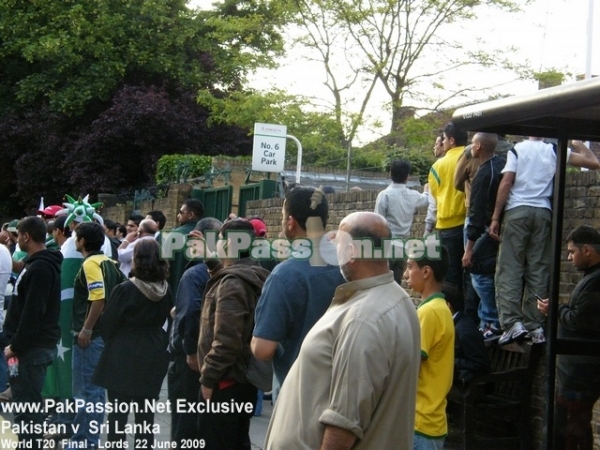 Pakistan supporters watch the team bus depart from Lords