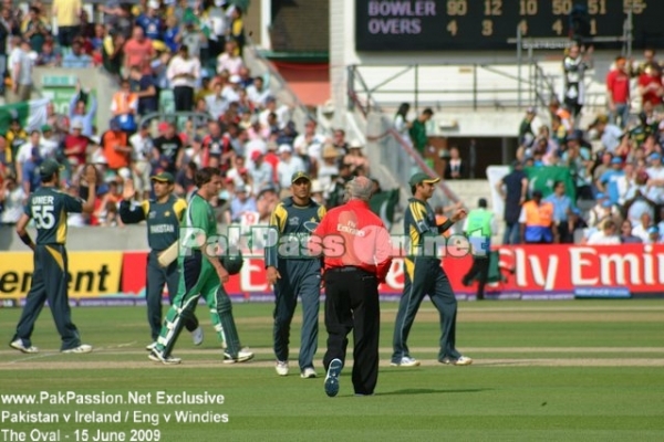 Pakistani players congratulate one another on victory against Ireland