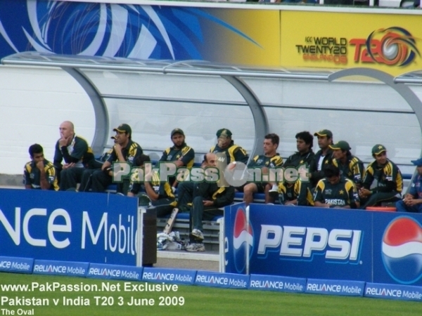 Pakistani team and coaching staff in the dugout