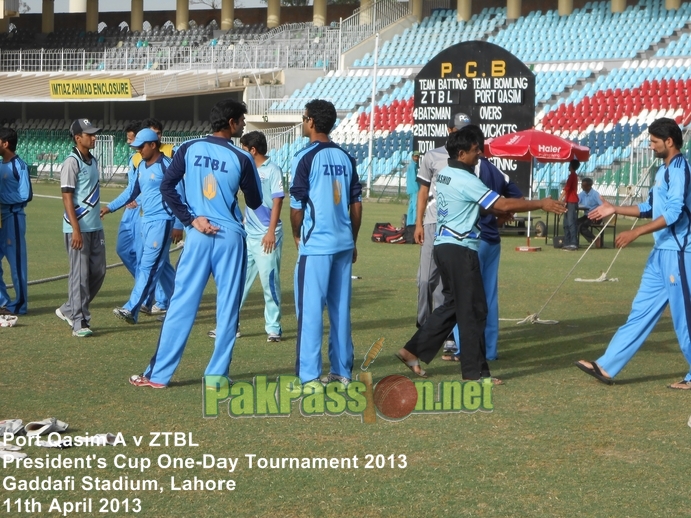 Players from Port Qasim and ZTBL shake hands