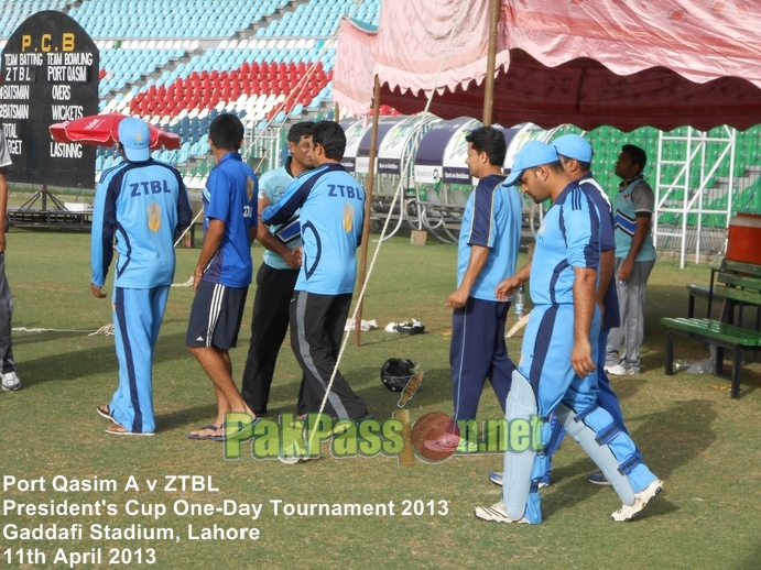 Players from Port Qasim and ZTBL shake hands