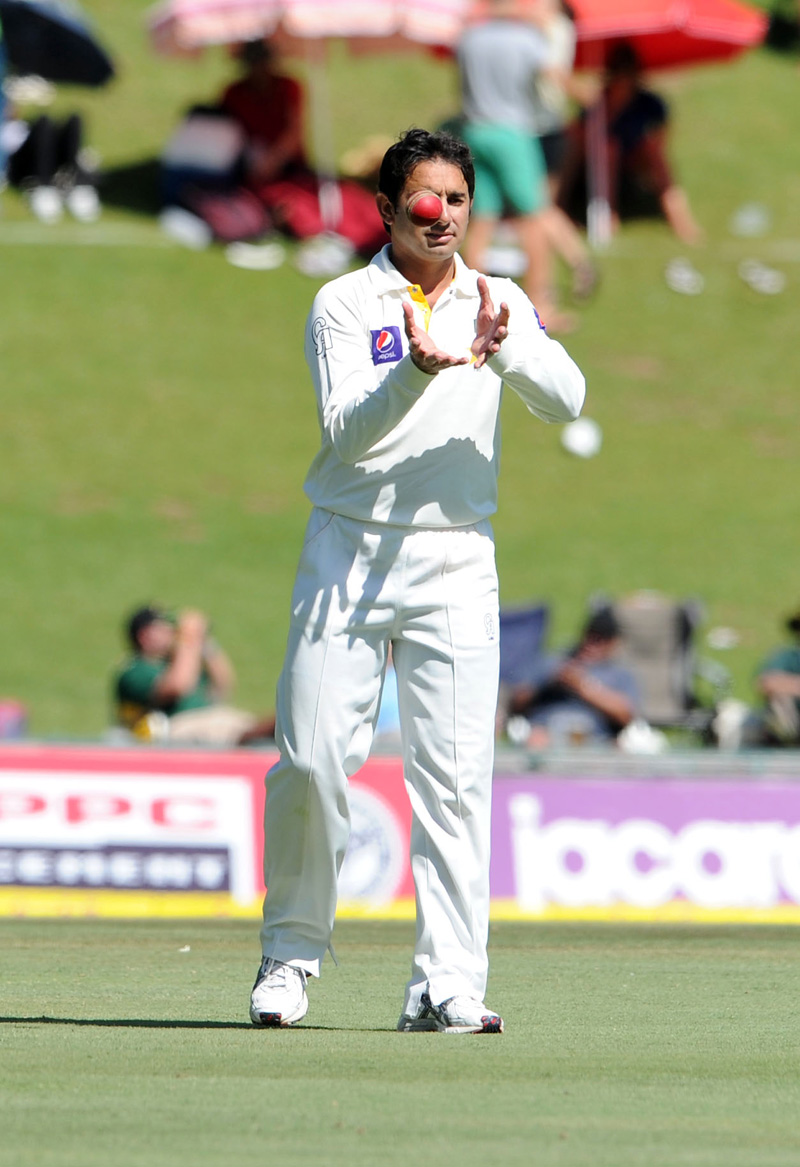 Saeed Ajmal with ball in hand gets ready to bowl